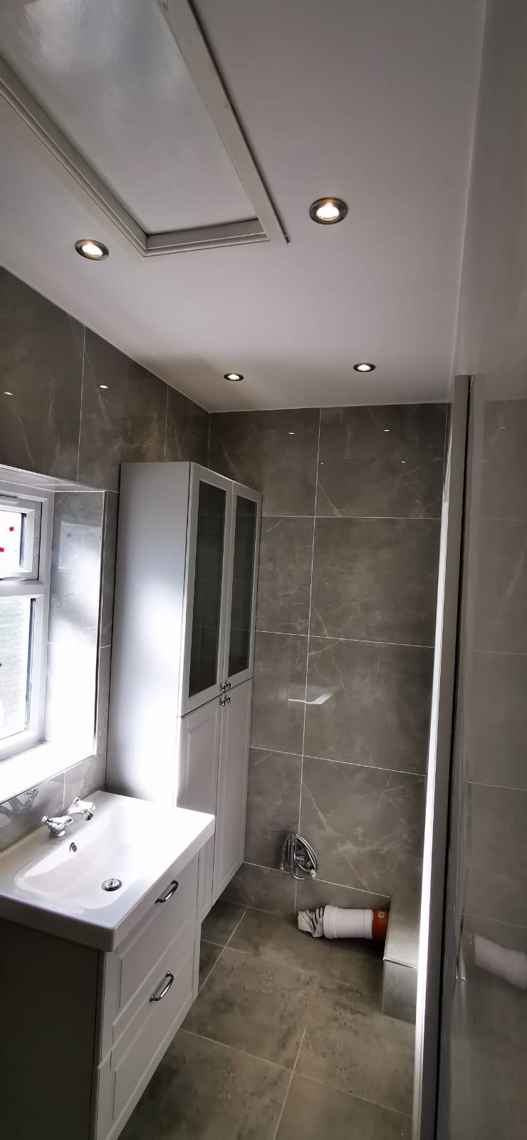 Grey bathroom refit by United 2 Plumb, West London